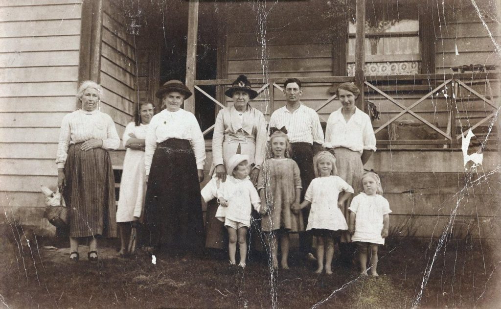Family group in front of house
